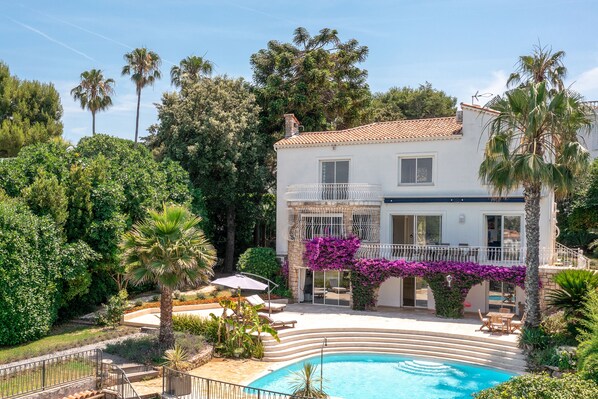 View of the villa, pool and gardens