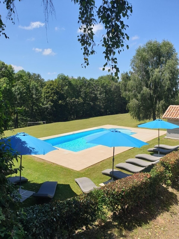 The pool is situated to the rear of the buildings in a secluded private suntrap 