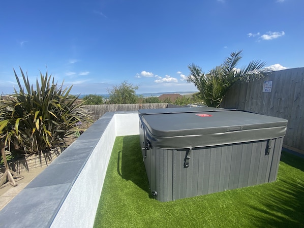 Hot tub with ocean and far reaching coastal views 