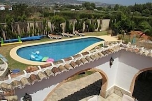 Swimming pool and back garden area