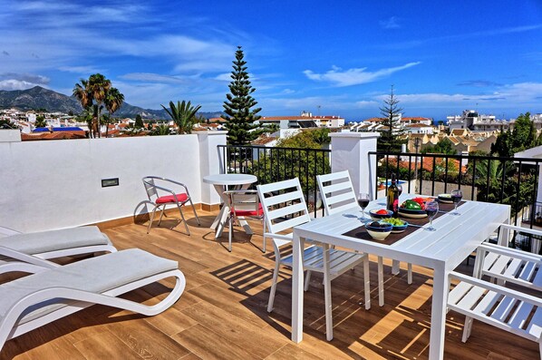 Private roof terrace with panoramic views over the mountains, town and sea.