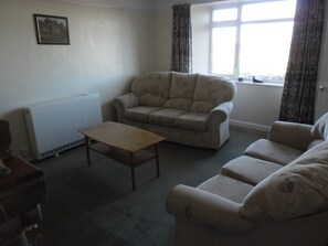 Comfortable sitting room with seating for six and views of the Ley.