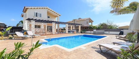 Pool (longways view), palm trees and rear patio