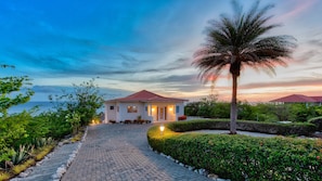 View Villa Lions Cliff seen from street side at sunset