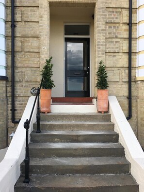 Front door of the house where the apartment is