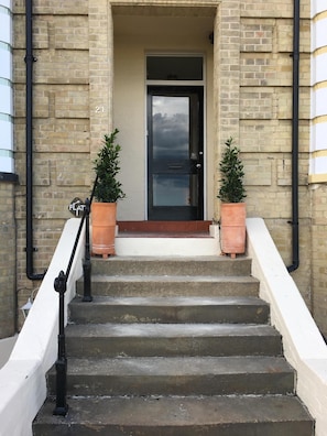 Front door of the house where the apartment is