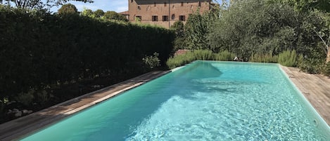 swimming pool with magnificent view on the local castle "Faà di Bruno"