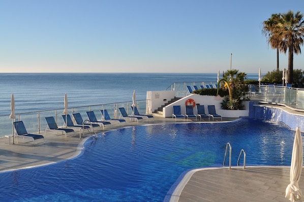 Beach pool and childrens pool above. Free sunchairs
