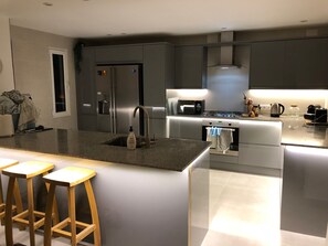 Downstairs kitchen in the evening.