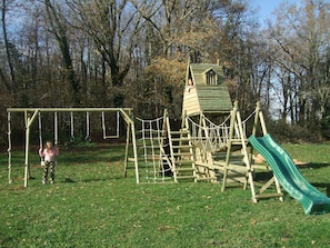 Play area, there is also a trampoline, baby swing and sand pit