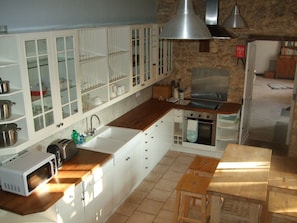 The kitchen at Rigal, induction hob, dishwasher, washing maching