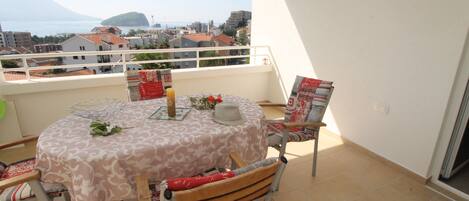 Balcony with table and chairs