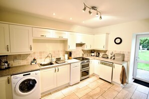 Kitchen with access to rear private garden