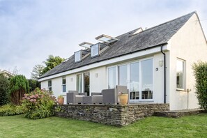 Back view and patio showing opening balcony Velux windows