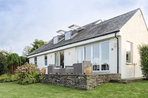 Back view and patio showing opening balcony Velux windows