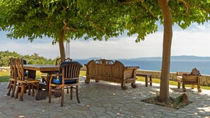Shaded dining and lounge areas with handmade wood furniture!