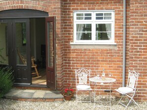 Sun trap garden for morning coffee,or drinks.