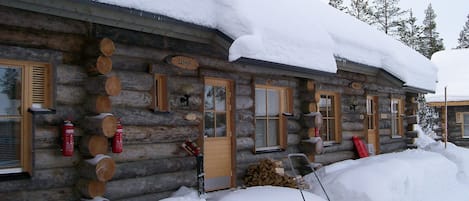 The cabin under its cozy blanket of snow
