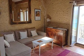 Charming interior with exposed beams and stone walls