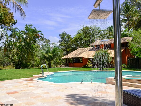 Pool with view to the orange house and river