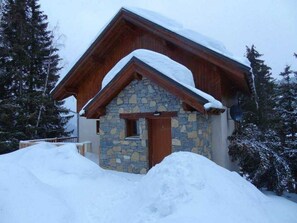 Chalet from top of stairs leading from the car park