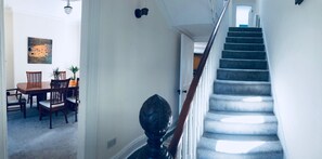 Large hallway leading to kitchen and lounge and upstairs bedrooms