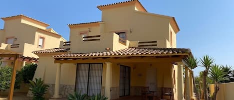 Villa front with patio area