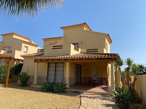 Villa front with patio area