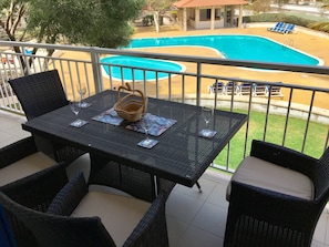 Balcony with view over pool