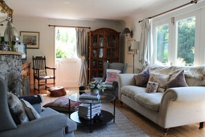 The sitting room is light and bright with bi-folding doors to the terrace 