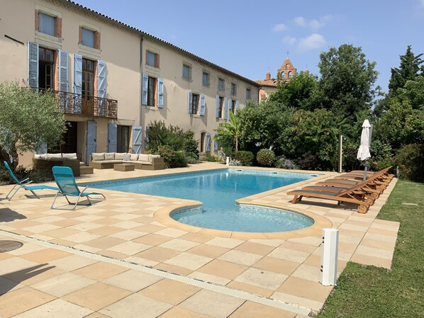 The house opens directly out to the pool area (which has a laser alarm)