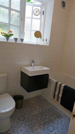 Bathroom with shower over bath