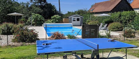 Table tennis by the pool