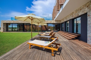 Patio and sun deck downstairs. 