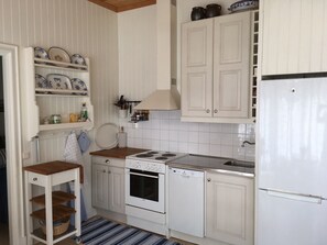Kitchen with dishwasher, refrigerator/freezer, stowe and oven.