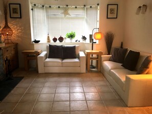 The warm and welcoming living room with TV/DVD/Firestick and CD/Aux/Vinyl Hifi