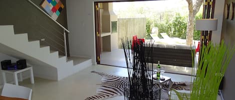 Open plan kitchen, dining area opening onto the garden