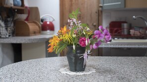 All Summer Anna puts beautiful flowers into the cottages...Bach kitchen...