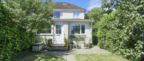 Private garden with wonderful seating area and plenty of space to run around.