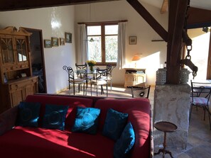 Open plan sitting room and dining area