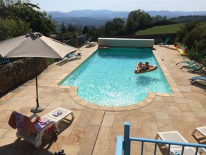 A pool with a view, West to the monts du Lyonnais and monts du Tarare