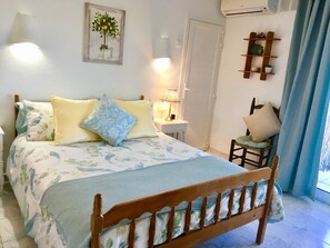 The ensuite double bedroom with air-cond. & french windows.