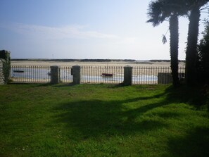 The laguna from the end of the garden with the gate and steps below.