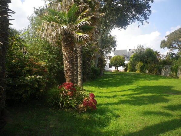 The house in the foreground from the end of the garden, beach side.