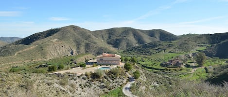 View from one of the peaks that surround the Villa