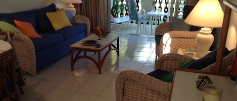 Living area with ceiling and standing fan