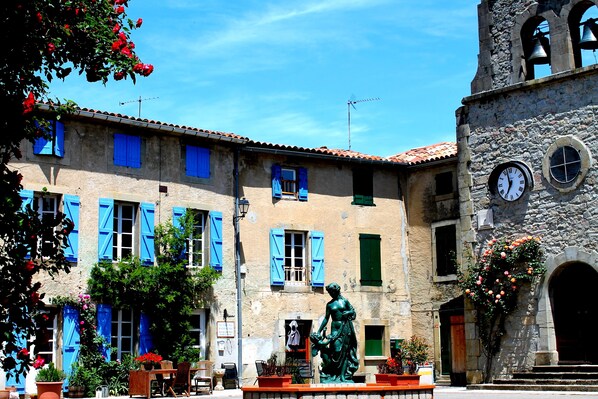 Chez Maison Bleue on the village square by the  beautiful old church