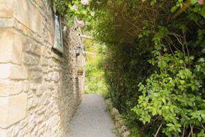 The path leading up to the cottage entrance.