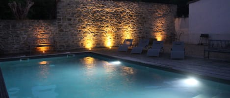 Pool and BBQ area at night time