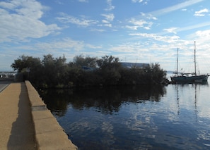 The boatyard and old boat outside the house